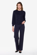 Load image into Gallery viewer, Woman wearing a navy blue outfit on a white background
