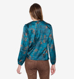 Load image into Gallery viewer, Person wearing a teal &amp; coper splash blouse and brown pants on a white background

