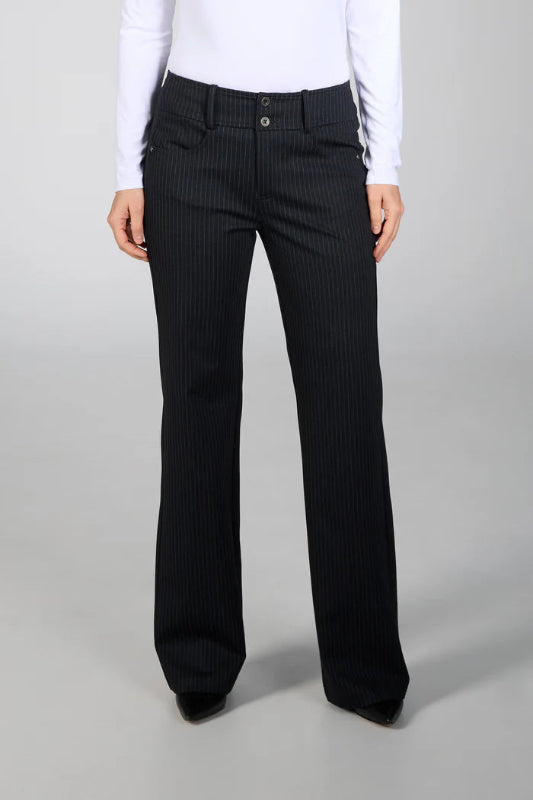 Black pinstripe pants worn by a person on a gray background