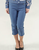 Load image into Gallery viewer, Woman wearing a blue floral jacket and pants on a white background
