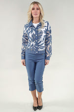 Load image into Gallery viewer, Woman wearing a blue floral jacket and pants on a white background
