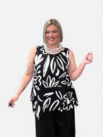 Load image into Gallery viewer, Woman wearing a black sleeveless top with white abstract patterns on a plain background
