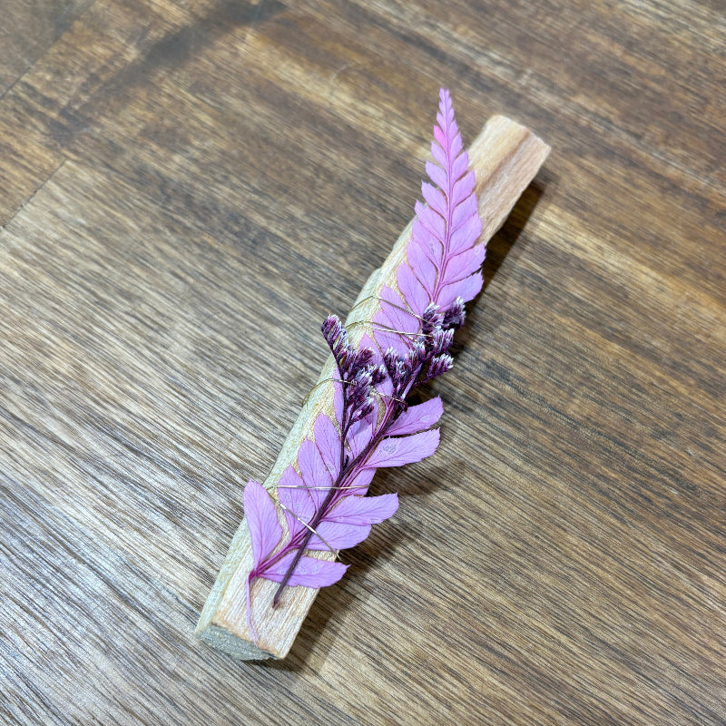 Decorative Palo Santo Sticks with dried flowers flowers wrapped in gold wire.