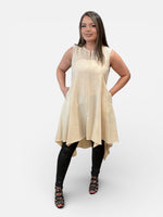 Load image into Gallery viewer, Woman wearing a beige tunic -sleeveless dress with black leggings and high-heeled shoes on a white background
