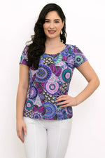 Load image into Gallery viewer, Woman wearing a colorful patterned top on a white background
