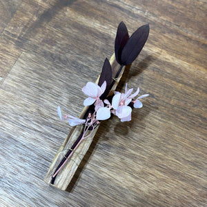 Decorative Palo Santo Sticks with dried flowers flowers wrapped in gold wire.