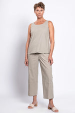 Load image into Gallery viewer, Woman wearing a beige sleeveless top and pants on a white background
