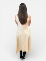 Load image into Gallery viewer, Woman wearing a beige sleeveless tunic dress against a white background
