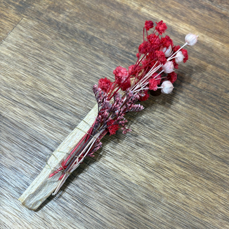 Decorative Palo Santo Sticks with dried flowers flowers wrapped in gold wire.