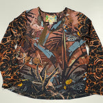 Load image into Gallery viewer, A long-sleeve top with a complex multicolor tropical and animal print pattern, laid flat on a white surface with a metal ruler visible underneath to indicate scale.
