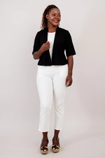Load image into Gallery viewer, Woman wearing a black bolero, white top, and white pants on a plain background
