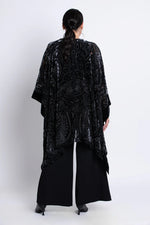 Load image into Gallery viewer, Woman wearing a black velvet patterned kimono on a white background
