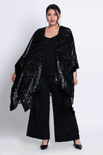 Load image into Gallery viewer, Woman wearing a black velvet patterned kimono on a white background
