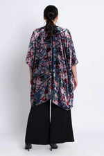 Load image into Gallery viewer, Woman wearing a floral velvet kimono over a black outfit on a white background
