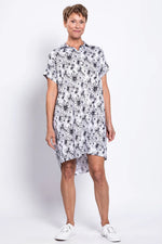 Load image into Gallery viewer, Woman wearing a black and white floral dress on a white background
