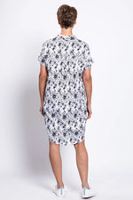 Load image into Gallery viewer, Person wearing a floral dress on a white background
