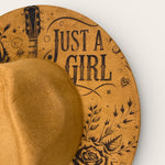 Load image into Gallery viewer, tan suede hat with 'Just a Girl' and 'Country Music' text on a white background
