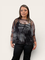 Load image into Gallery viewer, Woman wearing a sheer black top with a white background
