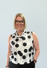 Load image into Gallery viewer, Woman wearing a sleeveless polka dot top and black pants against a light gray background
