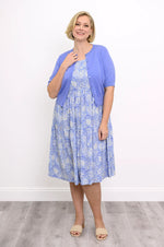 Load image into Gallery viewer, Woman wearing a blue floral dress and matching cardigan against a white background
