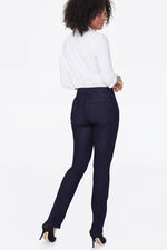 Load image into Gallery viewer, A woman shown from the back wearing dark navy blue straight leg jeans
