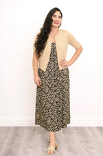 Load image into Gallery viewer, Woman wearing a patterned dress with a beige cardigan against a white background

