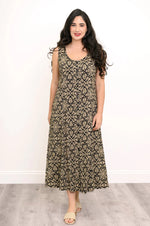 Load image into Gallery viewer, Woman wearing a patterned dress against a white background
