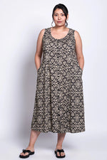Load image into Gallery viewer, Woman wearing a patterned dress on a white background
