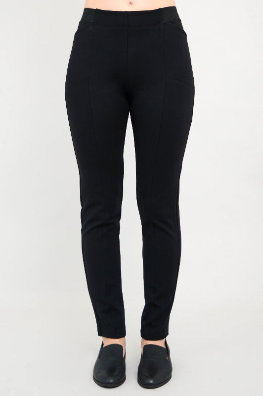 Black pants worn by a person on a white background