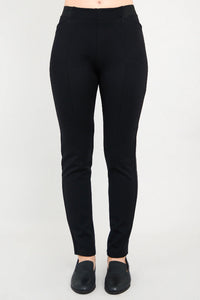 Black pants worn by a person on a white background