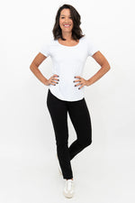 Load image into Gallery viewer, Woman wearing a white top and black pants on a white background

