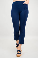 Load image into Gallery viewer, Navy blue pants worn by a person on a white background
