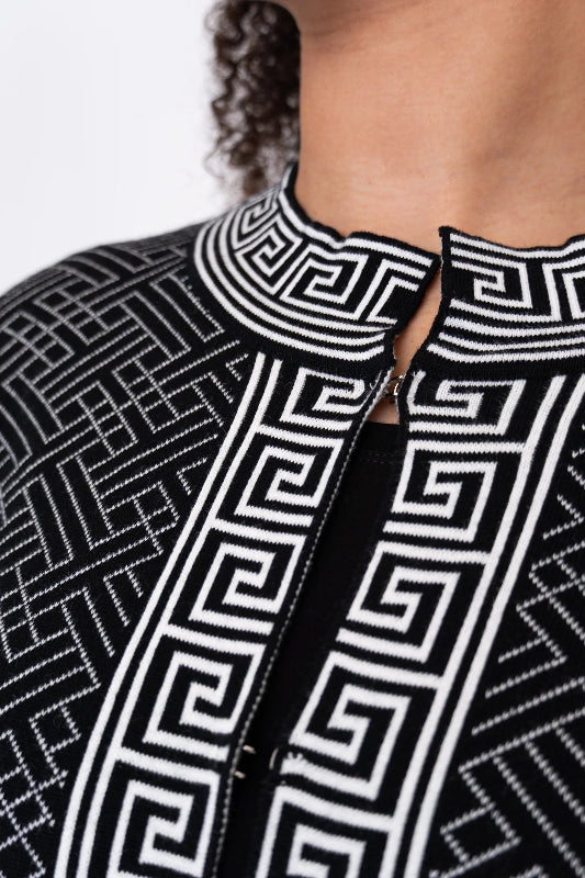 Woman wearing a black and white patterned cardigan 100% Cotton
