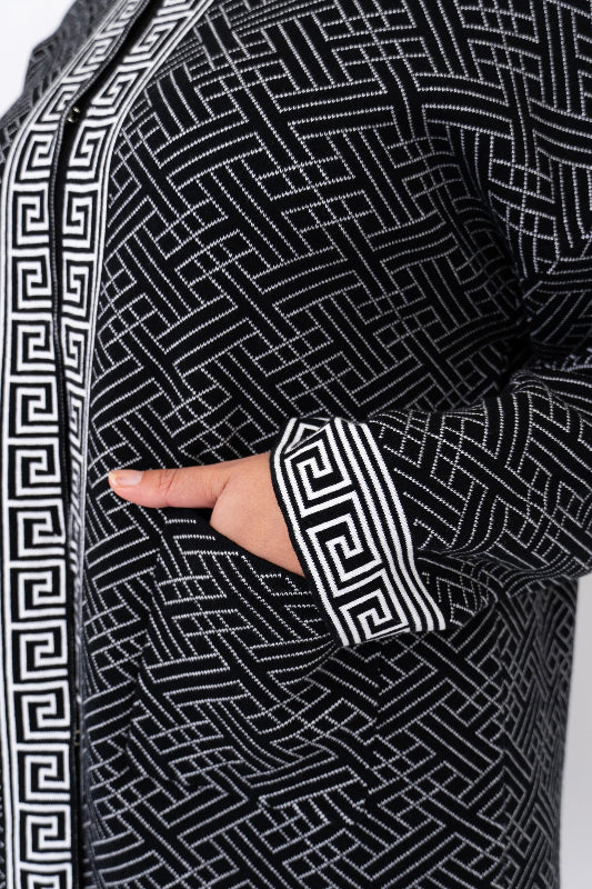 Woman wearing a black and white patterned cardigan 100% Cotton
