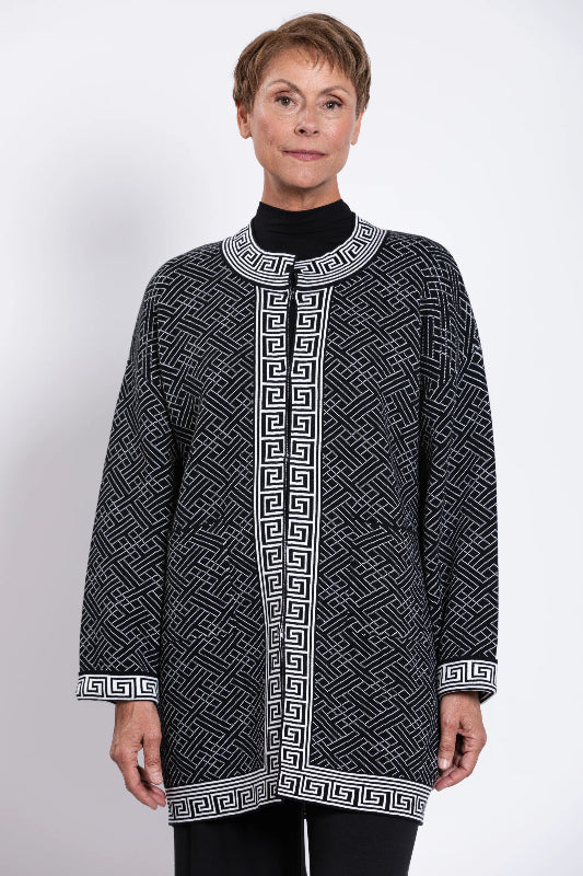 Woman wearing a black and white patterned cardigan 100% Cotton
