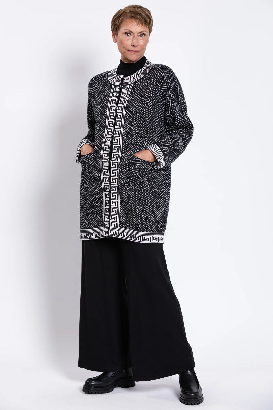 Woman wearing a black and white patterned cardigan 100% Cotton
