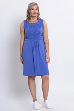 Load image into Gallery viewer, Woman wearing a blue dress on a white background
