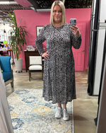 Load image into Gallery viewer, Woman taking a selfie wearing a grey mesh with velvet leopard print dress with white sneaker and boutique background
