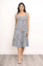 Load image into Gallery viewer, Woman wearing a sleeveless dress with a paisley pattern on a white background
