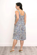 Load image into Gallery viewer, Woman wearing a patterned dress against a white background
