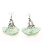 Load image into Gallery viewer, Mint green tassel earrings with silver hooks on a white background
