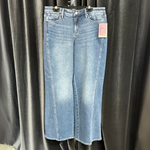 Load image into Gallery viewer, Pair of blue jeans with a tag on a black background
