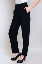 Load image into Gallery viewer, Person wearing black pants and black shoes on a plain background
