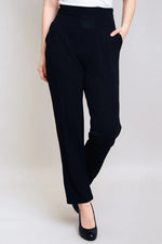Load image into Gallery viewer, Black pants worn by a person on a plain background
