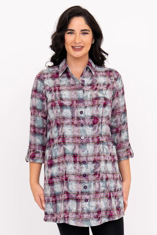 Woman wearing a plaid shirt on a white background