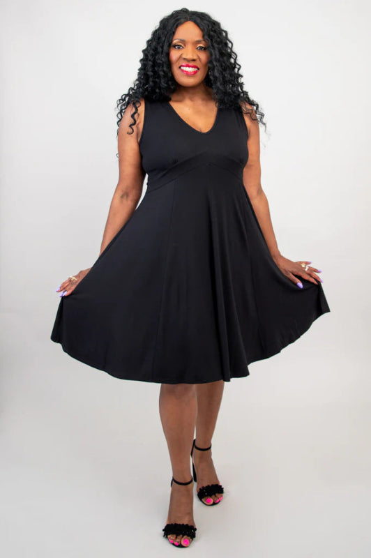 Woman wearing a black sleeveless dress on a white background