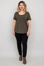 Load image into Gallery viewer, Woman wearing an olive green t-shirt and black pants on a plain background
