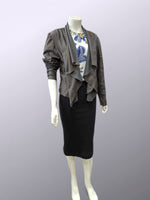 Load image into Gallery viewer, Mannequin wearing a gray/ brown jacket, black skirt, and graphic t-shirt on a light purple background
